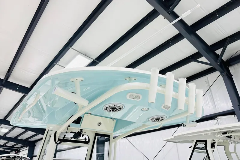Slide: The Image of 2026 Cobia 285 Center Console boat top view in a showroom. - 6