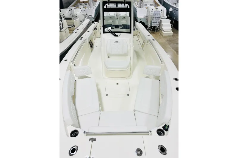 Slide: The Image of 2026 Cobia 285 Center Console boat interior with seating and console view. - 9