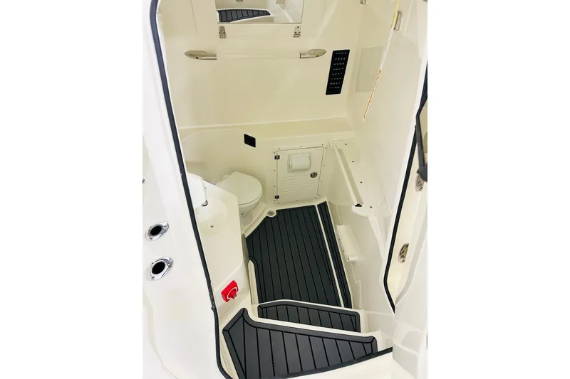 Slide: The Image of 2026 Cobia 305 Center Console interior cabin with modern amenities and sleek design. - 12