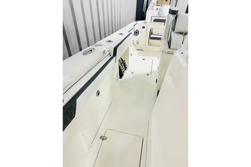 Slide: The Image of 2026 Cobia 305 Center Console boat interior, featuring sleek design and spacious layout. - 13