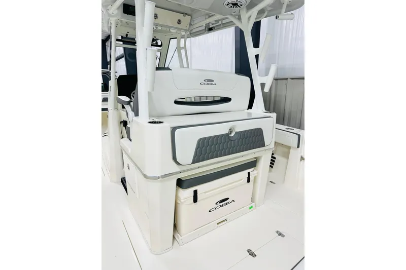 Slide: The Image of 2026 Cobia 305 Center Console boat interior with seating and storage features. - 5