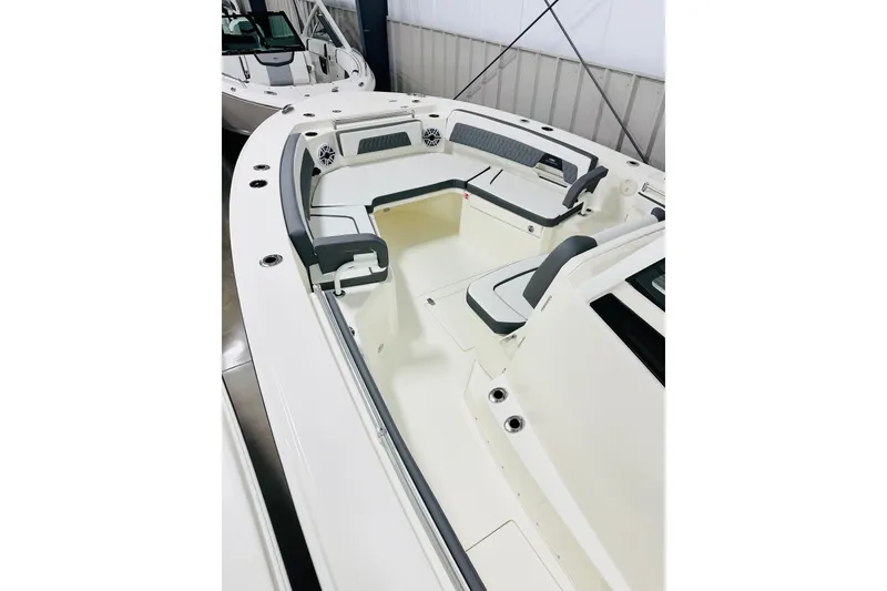 Slide: The Image of 2026 Cobia 305 Center Console boat interior with spacious seating and modern design. - 7