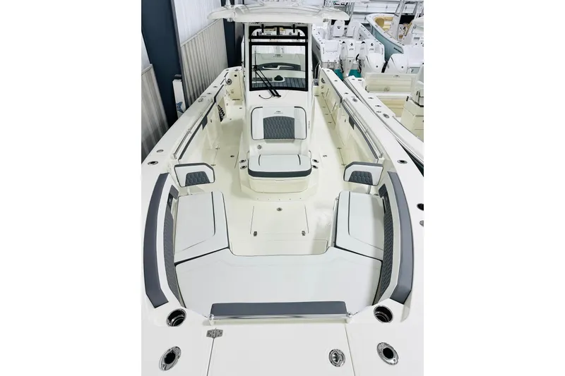 Slide: The Image of 2026 Cobia 305 Center Console boat with spacious seating and sleek design. - 9