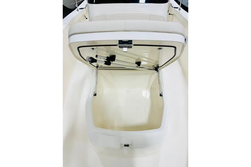 Slide: The Image of Open storage compartment on 2026 Scout 188 Sportfish boat, showcasing interior space. - 6