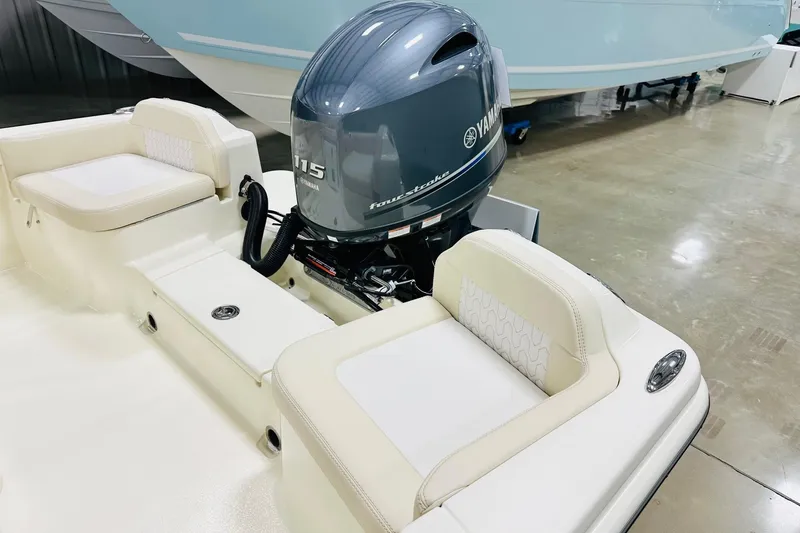 Slide: The Image of 2026 Scout 188 Sportfish boat with Yamaha 115 outboard motor, featuring comfortable seating. - 9