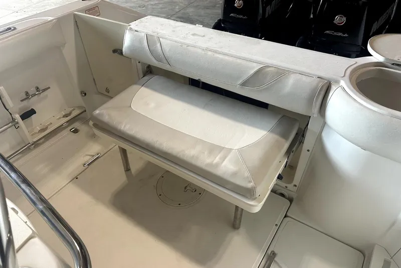 Slide: The Image of 2005 Boston Whaler 270 Outrage boat interior with steering console in storage facility. - 10