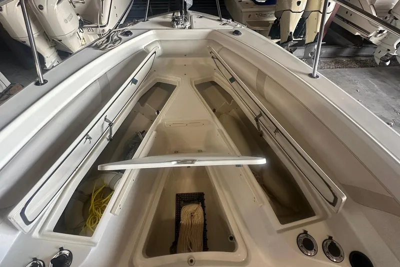 Slide: The Image of 2005 Boston Whaler 270 Outrage boat interior with seating and railings. - 14