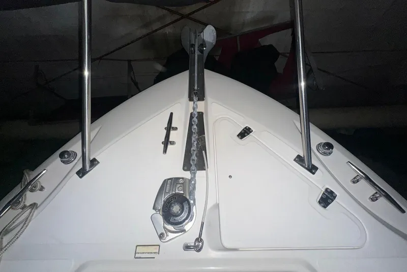 Slide: The Image of 2005 Boston Whaler 270 Outrage boat interior with seating and dual Mercury engines. - 15