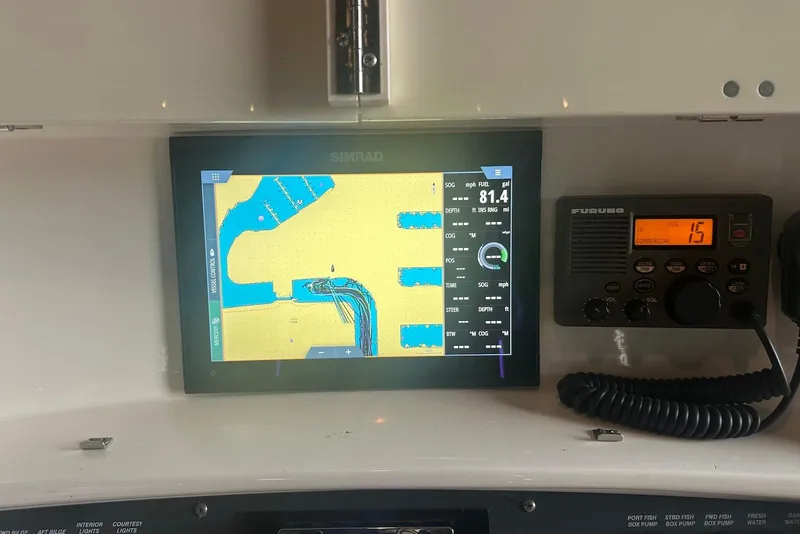 Slide: The Image of Storage compartment with rope on a 2005 Boston Whaler 270 Outrage boat. - 18