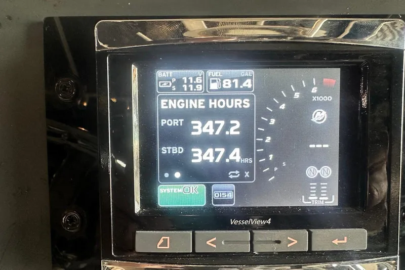 Slide: The Image of 2005 Boston Whaler 270 Outrage boat interior with open storage compartments. - 19