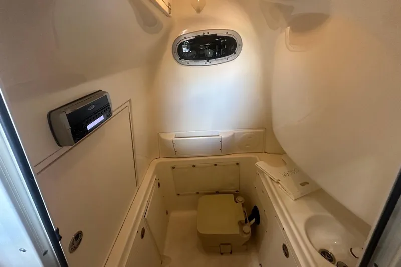 Slide: The Image of 2005 Boston Whaler 270 Outrage boat deck with anchor and railing. - 20