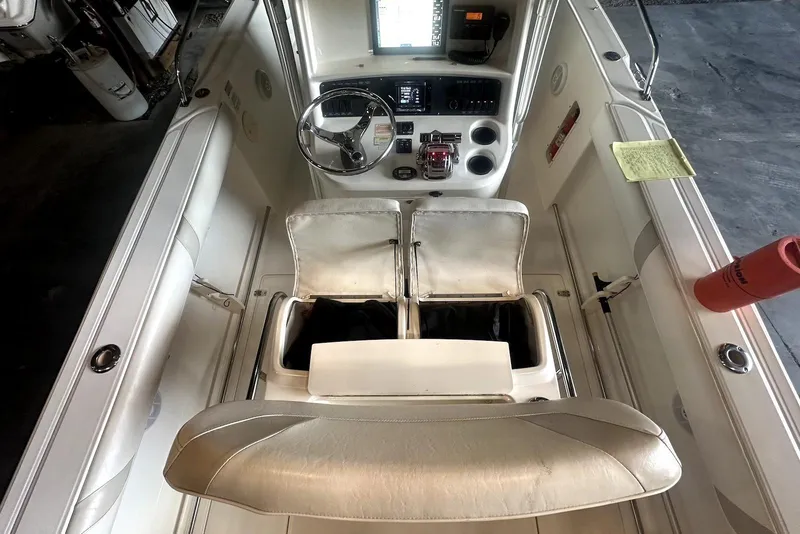 Slide: The Image of 2005 Boston Whaler 270 Outrage helm with steering wheel, controls, and navigation equipment. - 8