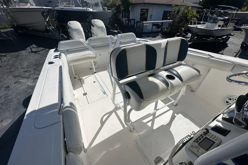 Slide: The Image of 2004 Marlago 35 FS boat interior with seating and control panel. - 13