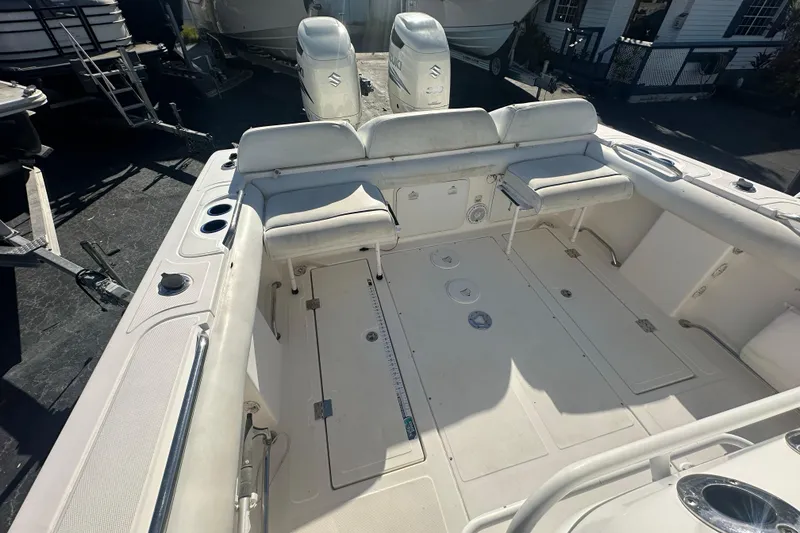 Slide: The Image of 2004 Marlago 35 FS boat interior with seating and storage compartments. - 17