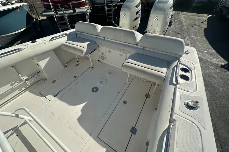 Slide: The Image of 2004 Marlago 35 FS boat interior with seating and storage compartments. - 19