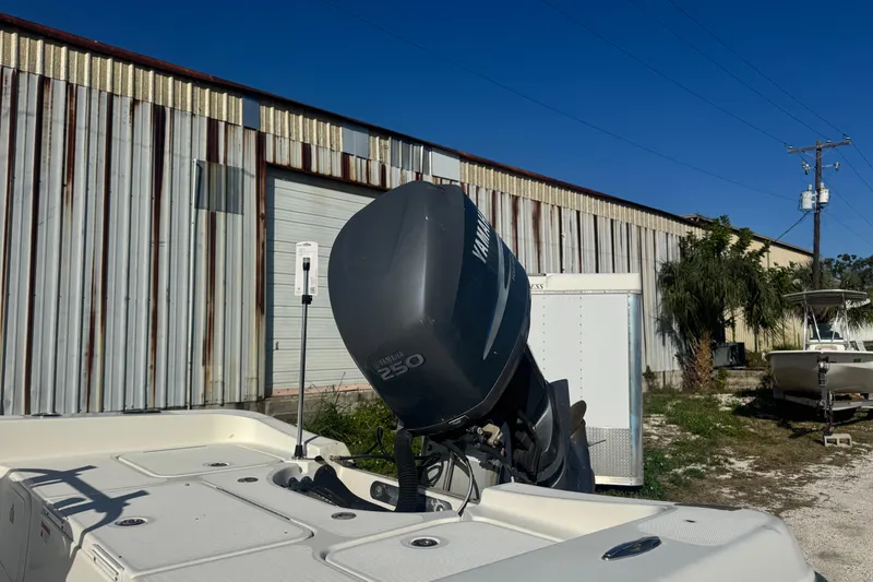 Slide: The Image of 2008 Hydra-Sports 2300 CC boat with Yamaha 250 engine near metal building. - 1