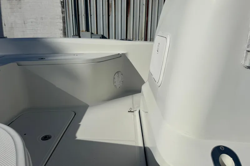 Slide: The Image of 2008 Hydra-Sports 2300 CC boat interior, featuring clean white deck and storage compartments. - 4