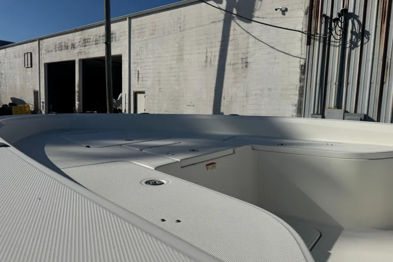 Slide: The Image of 2008 Hydra-Sports 2300 CC boat deck in a sunny industrial setting. - 5