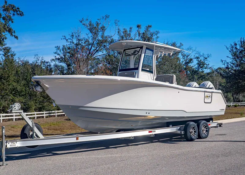 Slide: The Image of 2026 Sea Hunt Ultra 275 CB on trailer, side view. - 1
