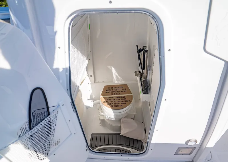 Slide: The Image of Interior of Sea Hunt Ultra 275 CB 2026 with toilet. - 23