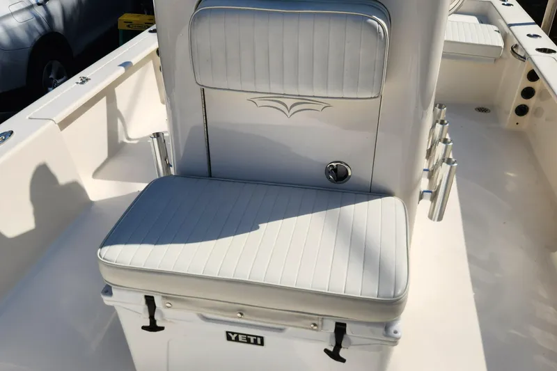 Slide: The Image of 2014 Islamorada Boatworks Morada 24 interior with steering console and seating. - 11