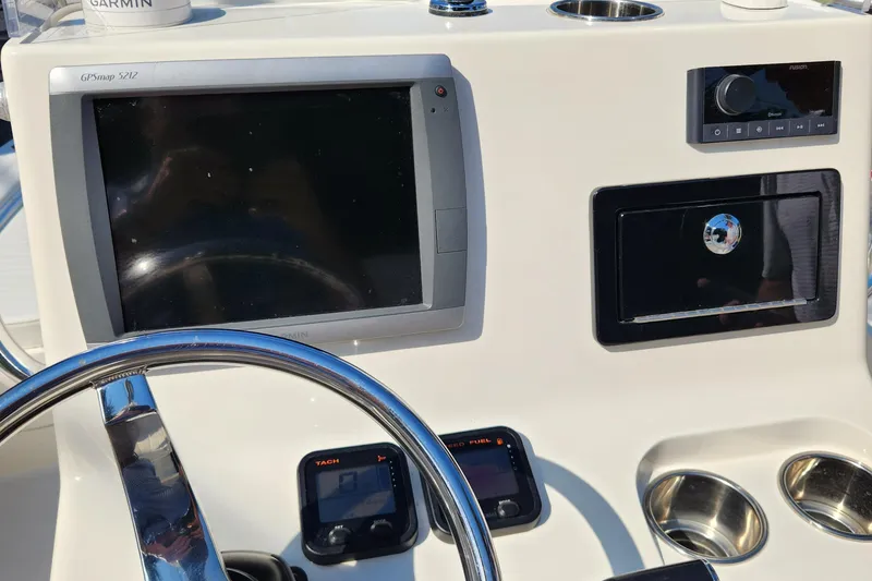 Slide: The Image of 2014 Islamorada Boatworks Morada 24, featuring rod holders and sleek design. - 12