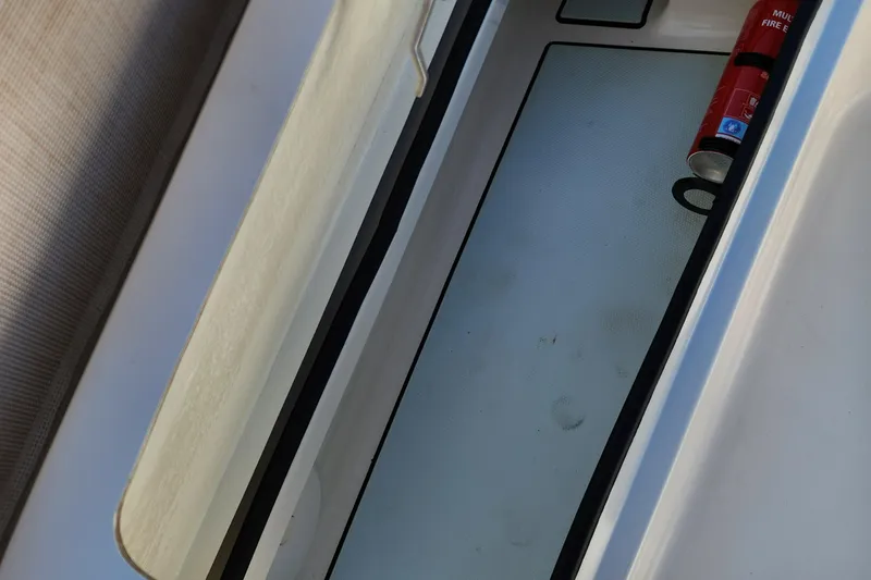 Slide: The Image of Storage compartment of 2014 Islamorada Boatworks Morada 24 with anchor, chain, and buoy. - 16