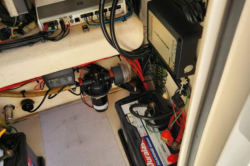 Slide: The Image of Storage compartment of a 2014 Islamorada Boatworks Morada 24 with a fire extinguisher. - 18