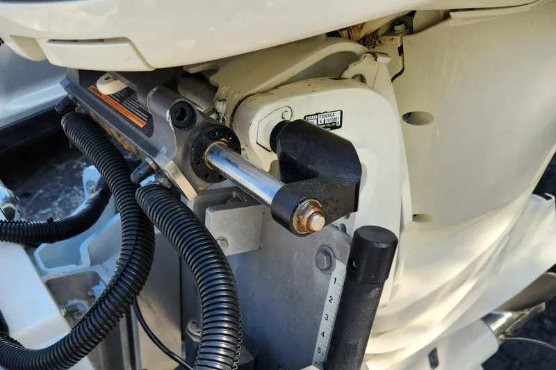 Slide: The Image of 2014 Islamorada Boatworks Morada 24 battery compartment with wiring and marine equipment. - 21