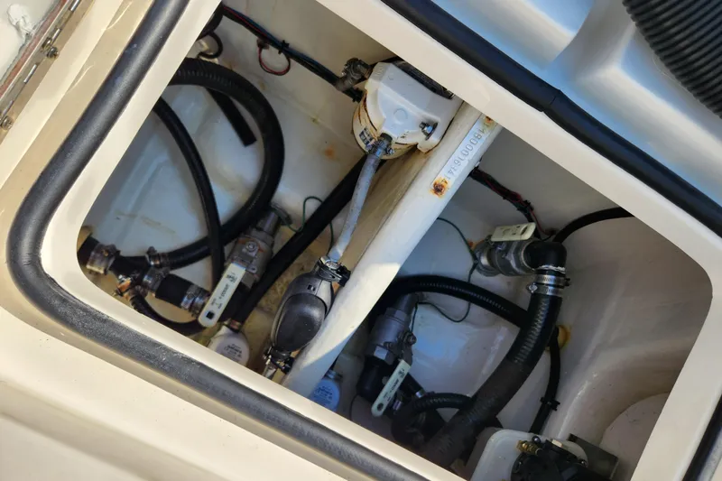 Slide: The Image of 2014 Islamorada Boatworks Morada 24 with Yamaha outboard motor in a parking lot. - 22