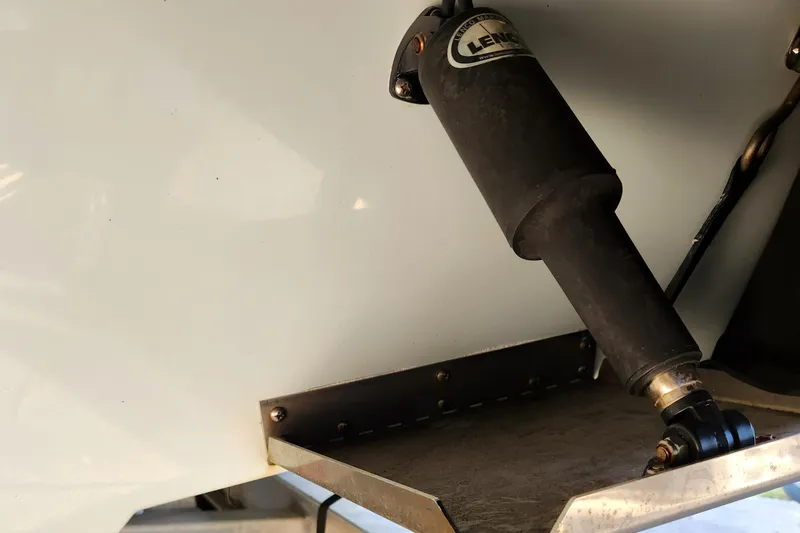 Slide: The Image of 2014 Islamorada Boatworks Morada 24 bilge compartment with hoses and pumps. - 24