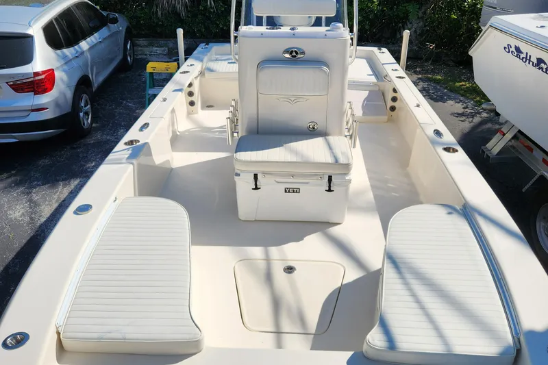 Slide: The Image of 2014 Islamorada Boatworks Morada 24 center console boat, parked outdoors. - 8