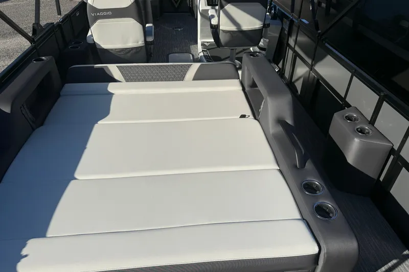 Slide: The Image of 2026 Viaggio Lago Z-S boat interior with luxurious seating and cup holders. - 7