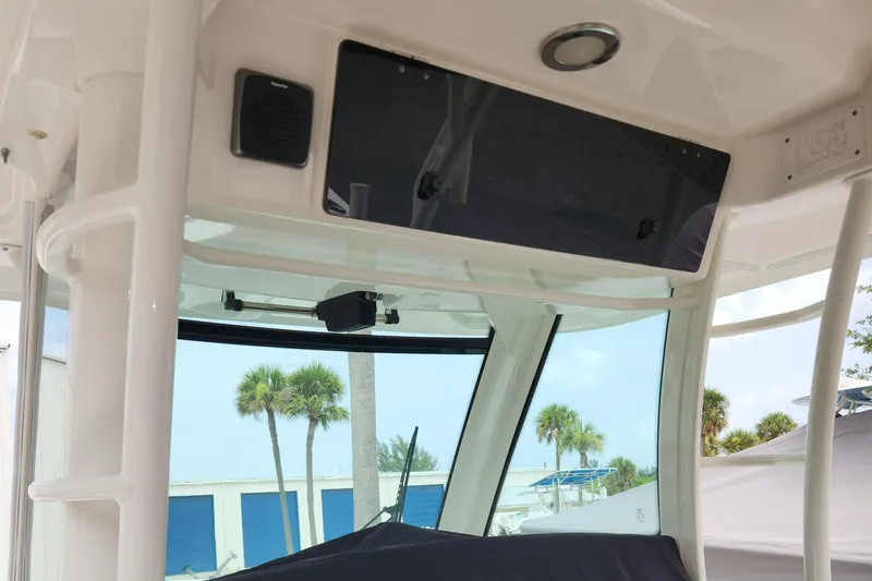 Slide: The Image of 2014 Boston Whaler 350 Outrage helm station with electronics and windshield. - 10