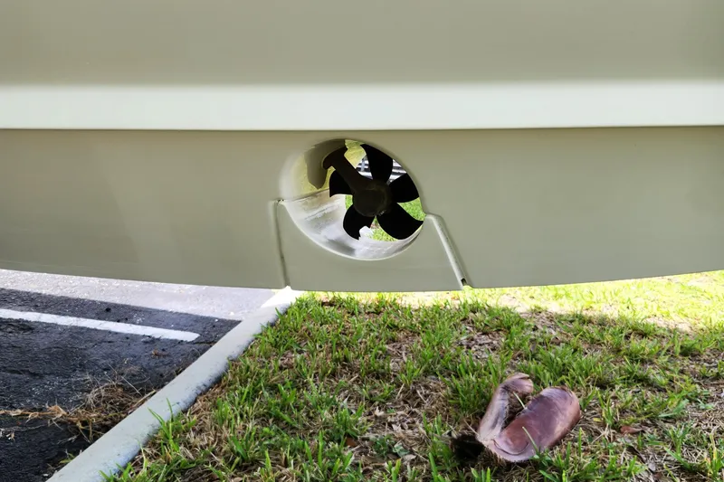 Slide: The Image of Close-up of 2014 Boston Whaler 350 Outrage boat propeller on grass. - 40