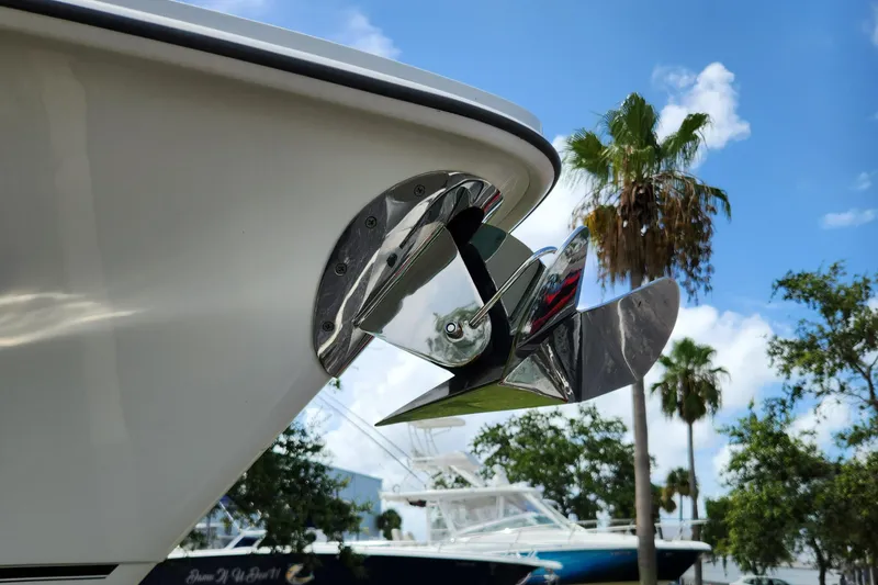 Slide: The Image of Close-up of 2014 Boston Whaler 350 Outrage anchor with palm trees in background. - 46