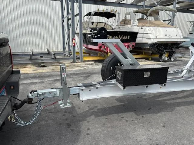 Slide: The Image of Trailer with Boston Whaler 350 Outrage boat in background. - 48