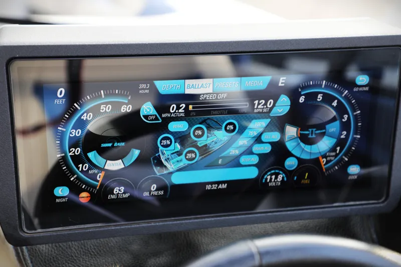 Slide: The Image of Dashboard of 2016 Malibu Wakesetter 20 VTX showing digital controls and gauges. - 12