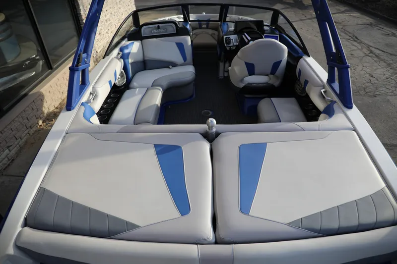 Slide: The Image of 2016 Malibu Wakesetter 20 VTX interior with blue and gray seating, showcasing luxury design. - 4
