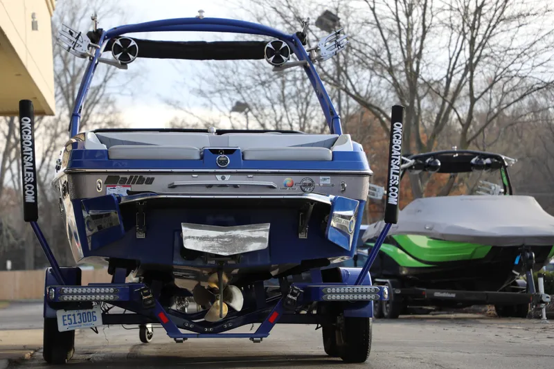 Slide: The Image of 2016 Malibu Wakesetter 20 VTX boat on trailer, parked outdoors. - 5