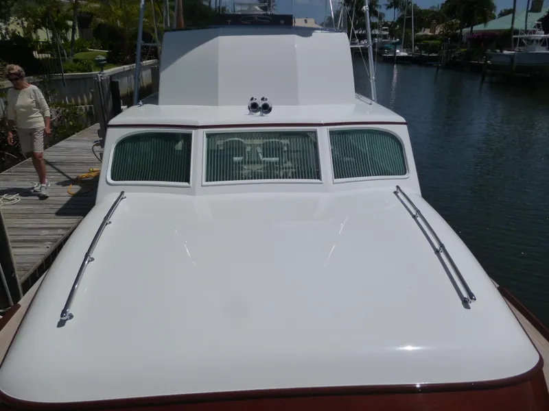 Slide: The Image of 1949 Rybovich Sport Fish boat docked on a sunny day. - 15