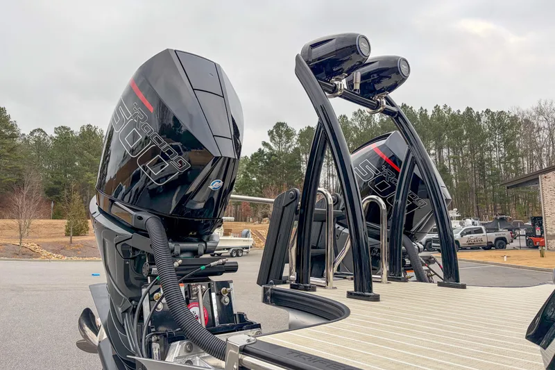 Slide: The Image of 2026 Trifecta Sport RF9 DC boat with powerful outboard engines in a scenic outdoor setting. - 3