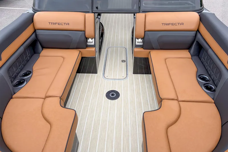 Slide: The Image of Luxurious interior of 2026 Trifecta Sport RF9 DC boat with tan seating and cup holders. - 6