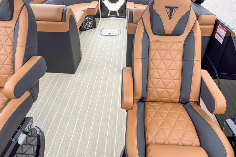 Slide: The Image of Luxurious interior of 2026 Trifecta Sport RF9 DC with tan and black seating. - 8