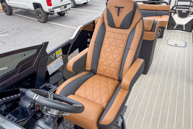 Slide: The Image of Luxurious Trifecta Sport RF9 DC 2026 boat interior with tan and black seating. - 9