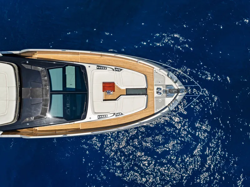 Slide: The Image of Aerial view of Riva 82' Diva yacht on blue water, 2027 model. - 14