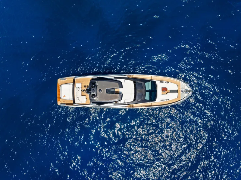 Slide: The Image of Aerial view of Riva 82' Diva yacht on blue water. - 15