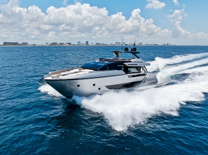 Slide: The Image of Luxury yacht Riva 82' Diva 2027 cruising on open sea. - 2