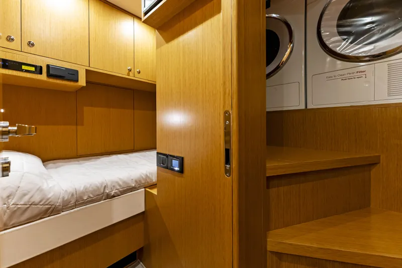 Slide: The Image of Interior of 2027 Riva 82' Diva yacht with wood paneling and washer. - 44