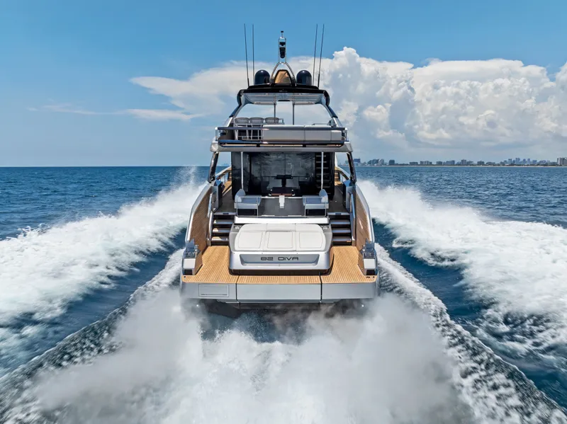 Slide: The Image of Riva 82' Diva Yacht 2027 cruising on open sea, rear view. - 7